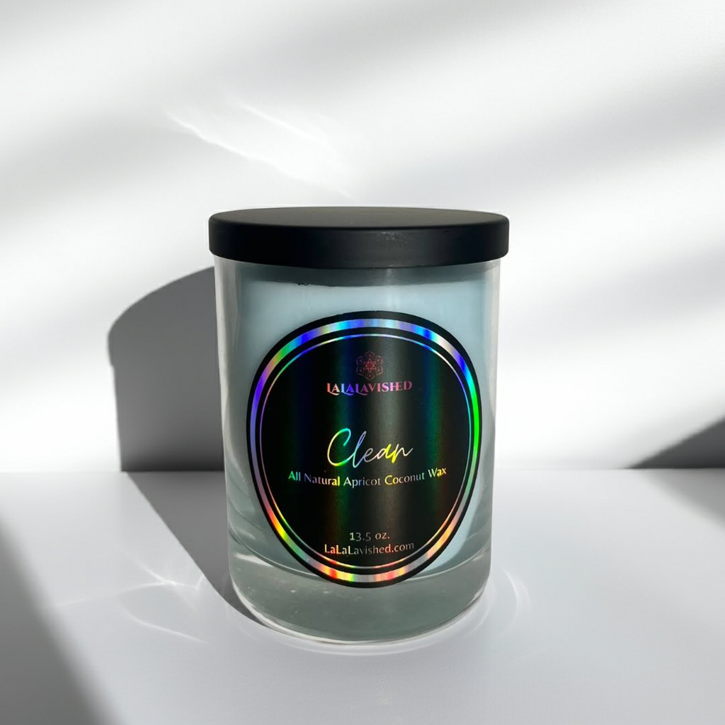 Candle with a colorful label on a reflective surface