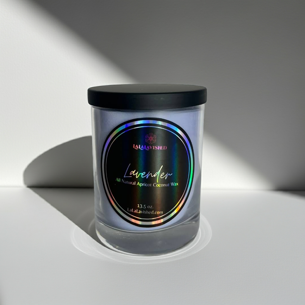 Candle jar with a black lid and colorful label on a white background