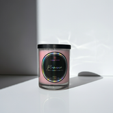 Pink Candle jar with a colorful holographic label on a white surface