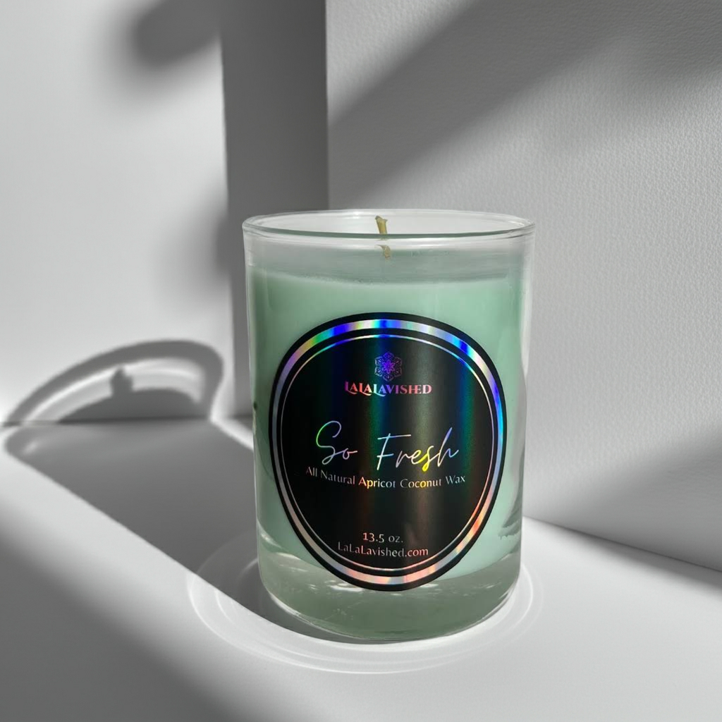 Green so fresh Candle in a glass jar with a label on a white surface