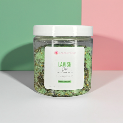Jar of green bath salts with a label on a colorful background