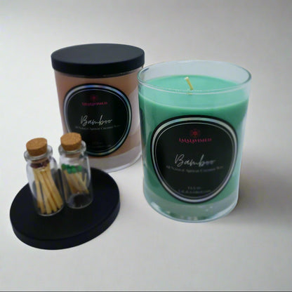 2 candles one brown bamboo candle one green candle with matching matches 